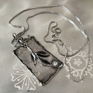 Silpada Sterling pendant with leaf design, pearl, and rhinestone detail